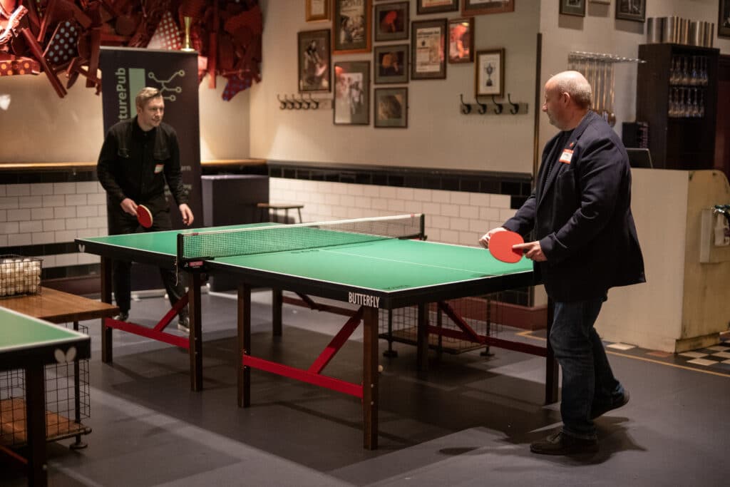 Attendees playing table tennis