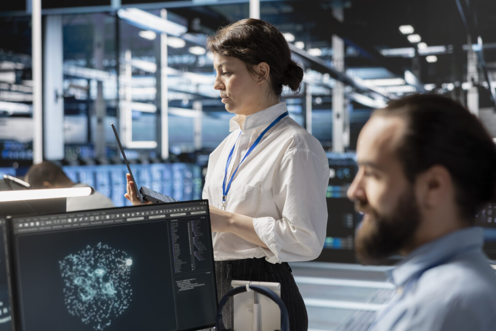 Admins using computer in data center office, running scripts